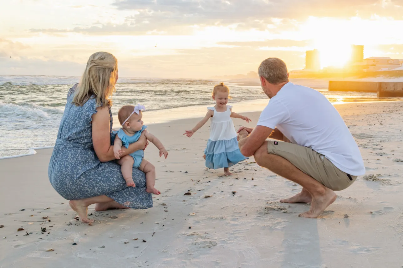 Candid shot of a kid running during a Gulf Shores family beach photoshoot.